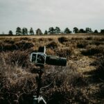 Directional microphone on a stand in a windswept heathland landscape